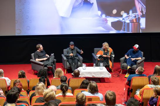 Stephen Graham, Hannah Walters and Philip Barantini sit in a cinema on a panel discussion