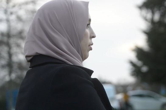 Side on view of a woman in a hijab.