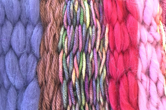 A range of pink, purple and brown wools that vary in thickness