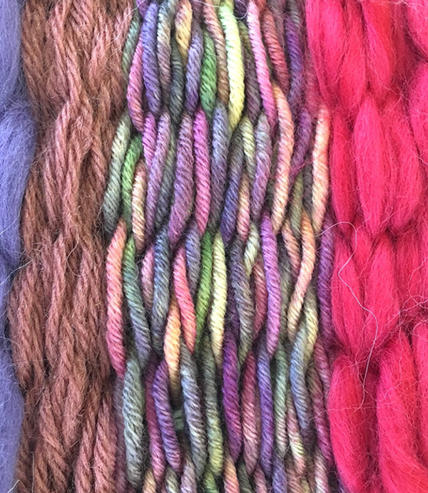 A range of pink, purple and brown wools that vary in thickness