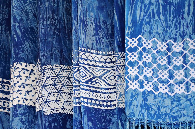 A range of fabric, dyed blue with white patterns on them
