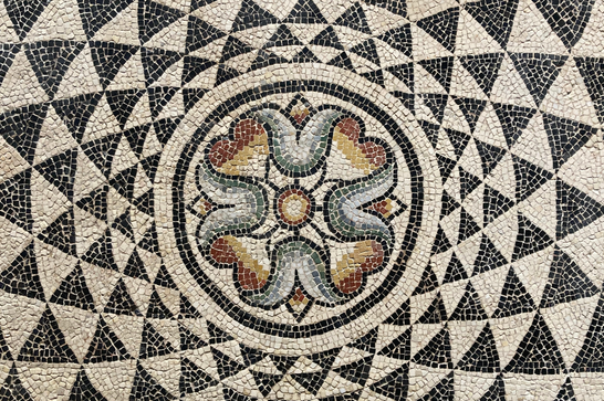 Muted mosaic tiles formed in a geometric pattern