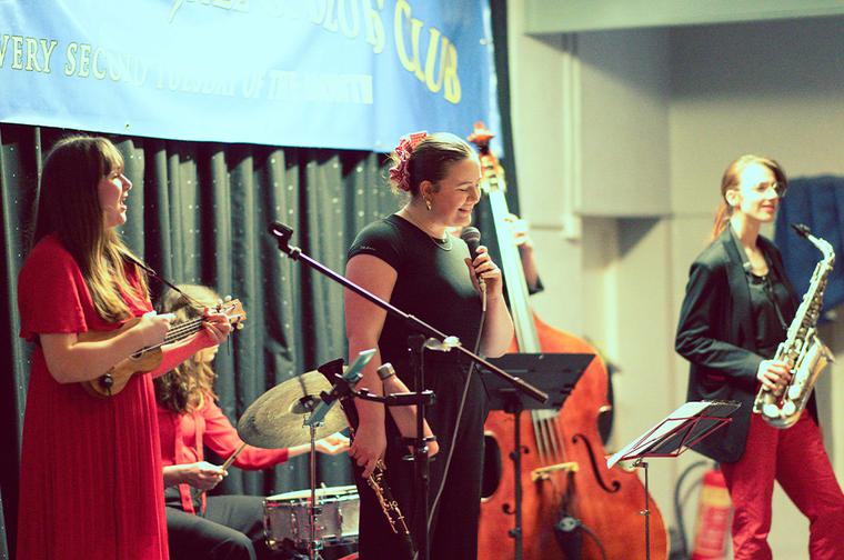 Three people with a cello, violin and saxophone