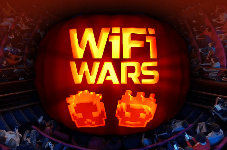 Large orange and white text with the words 'WiFi Wars'. The text is spooky and glowing. It looks like a pumpkin.
