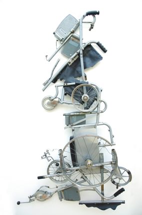 Sculpture of Great Britain map made out of wheelchair parts on a white background